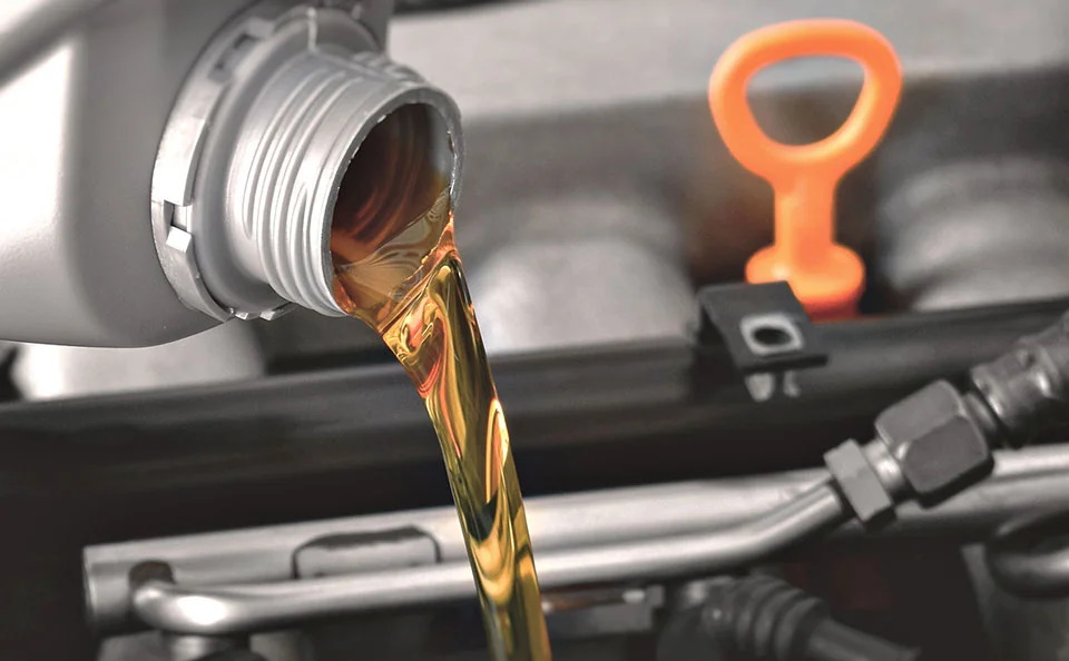 Motor Oil being poured into a vehicle